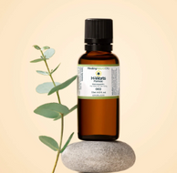 a bottle of natural plantar wart remover made of essential oils sitting on top of a rock